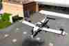 Students pushing a plane out of an AIM hangar