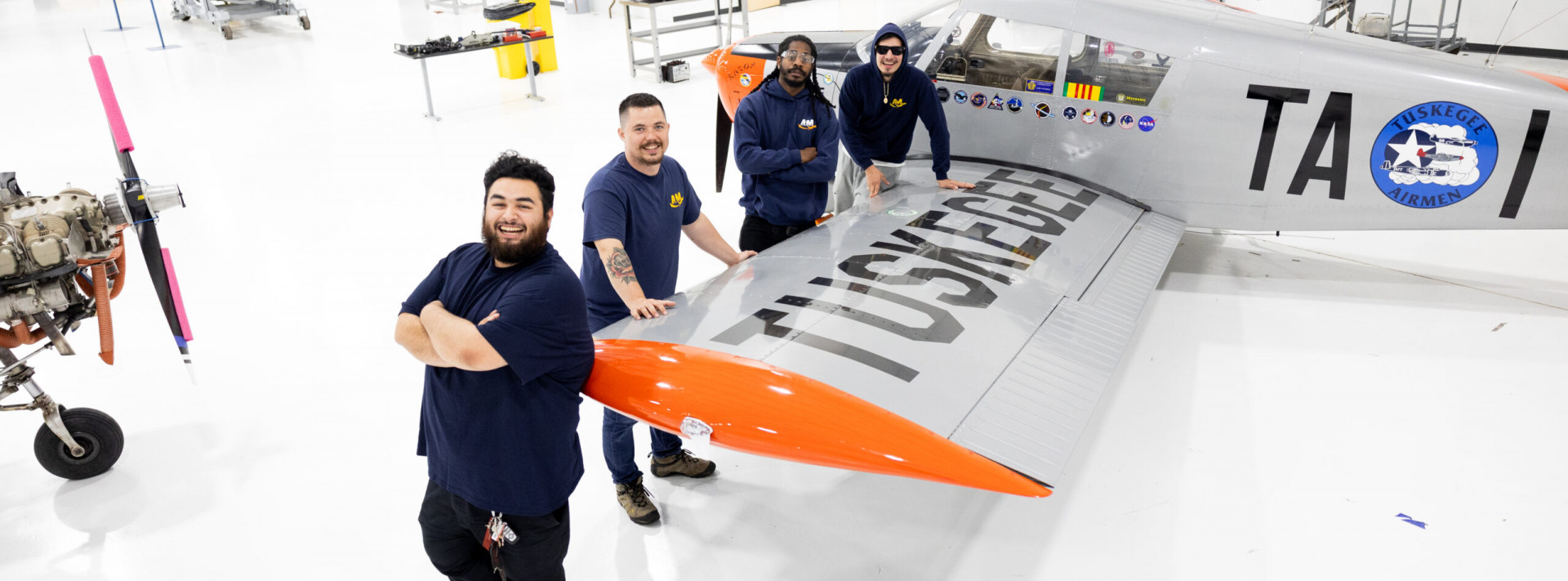 AIM students in a campus hangar