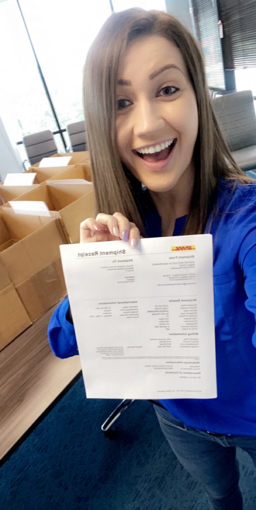 AIM female employee donates these 30 boxes of laptops