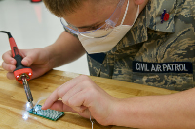 CAP cadet soldering a chip