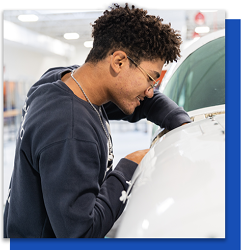 AIM student working on a plane